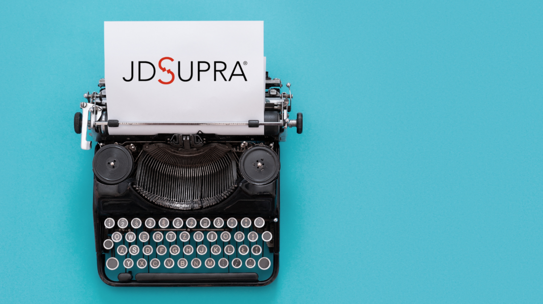 Typewriter with JDSupra logo showing on top of otherwise blank page