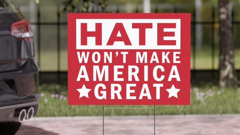 yard sign saying "hate won't make America great"